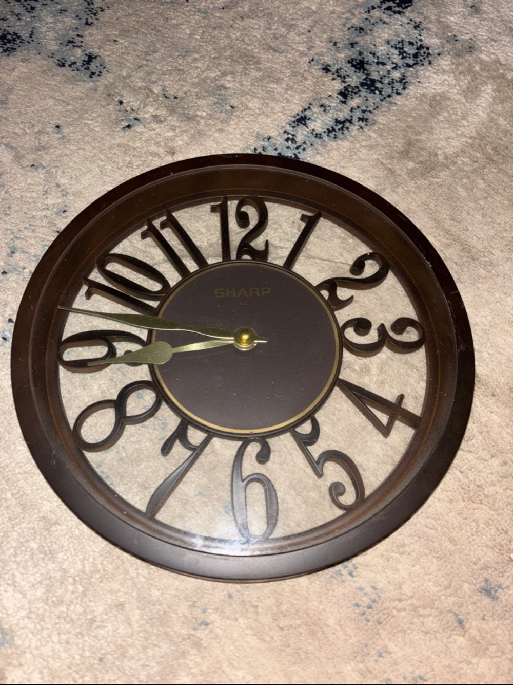 Sharp Brown Open-Style Wall Clock with Decorative Numerals
